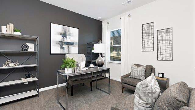 carpeted bedroom with small window