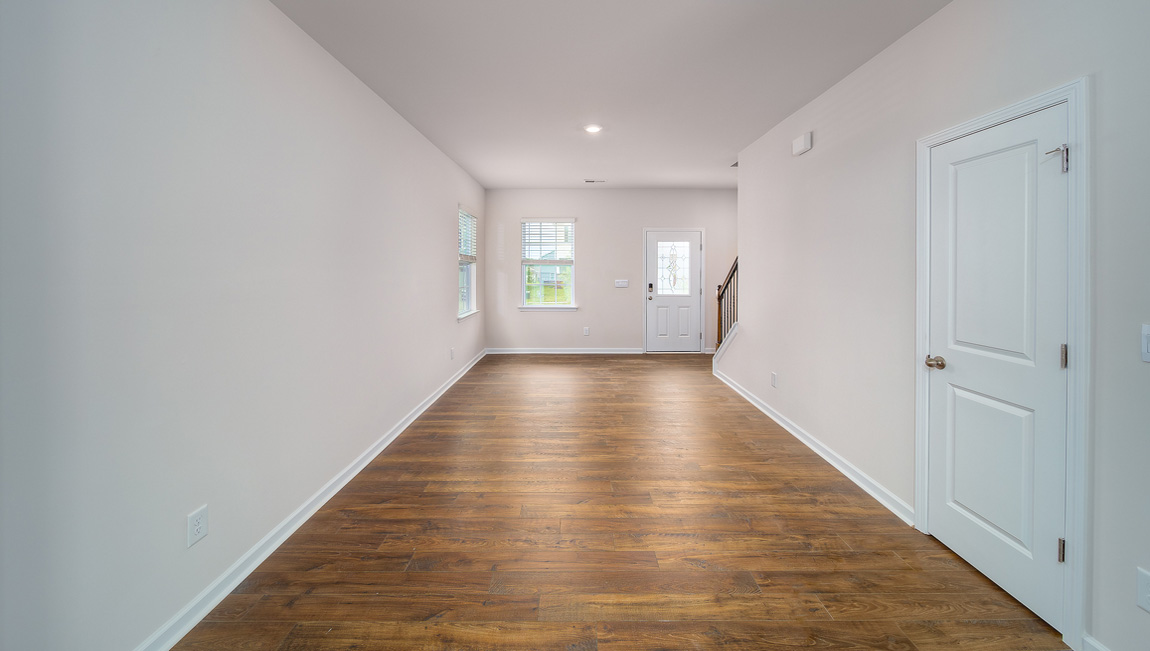 Family room with large windows and fireplace