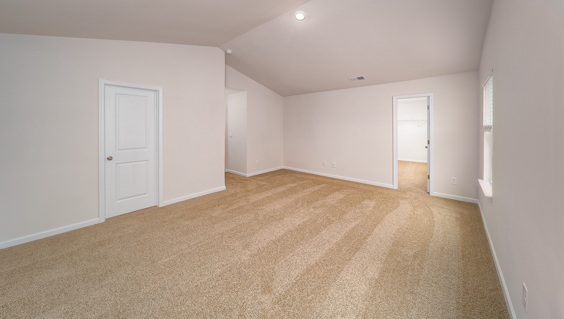 Primary bedroom, carpeted, two large windows