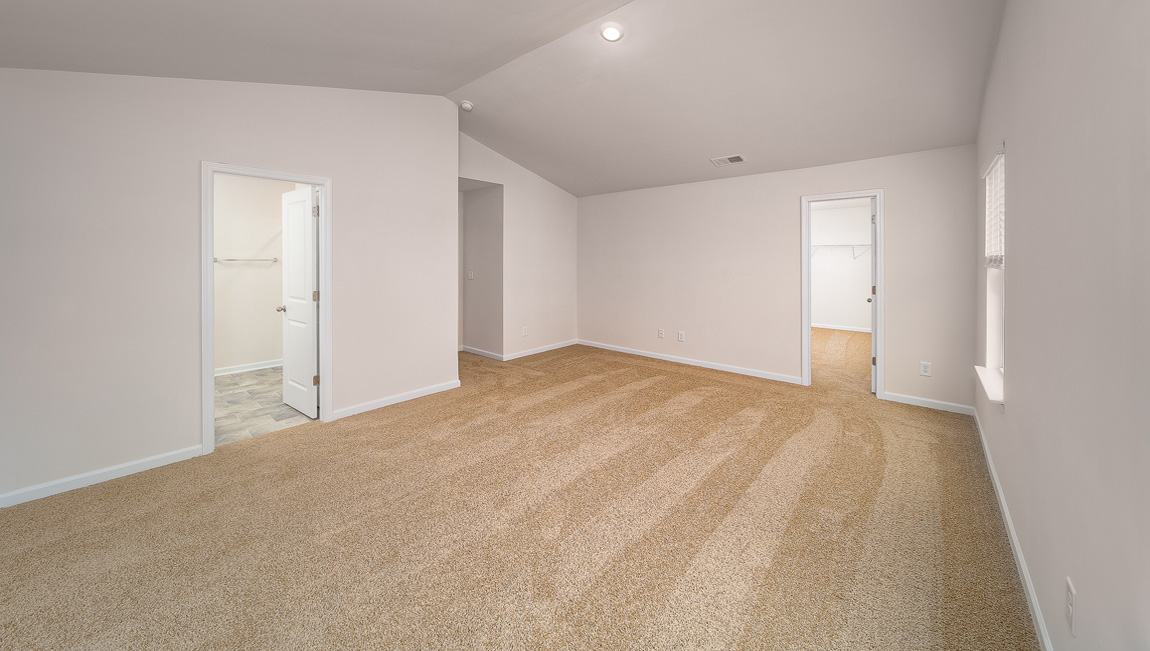 Primary bedroom, carpeted, two large windows