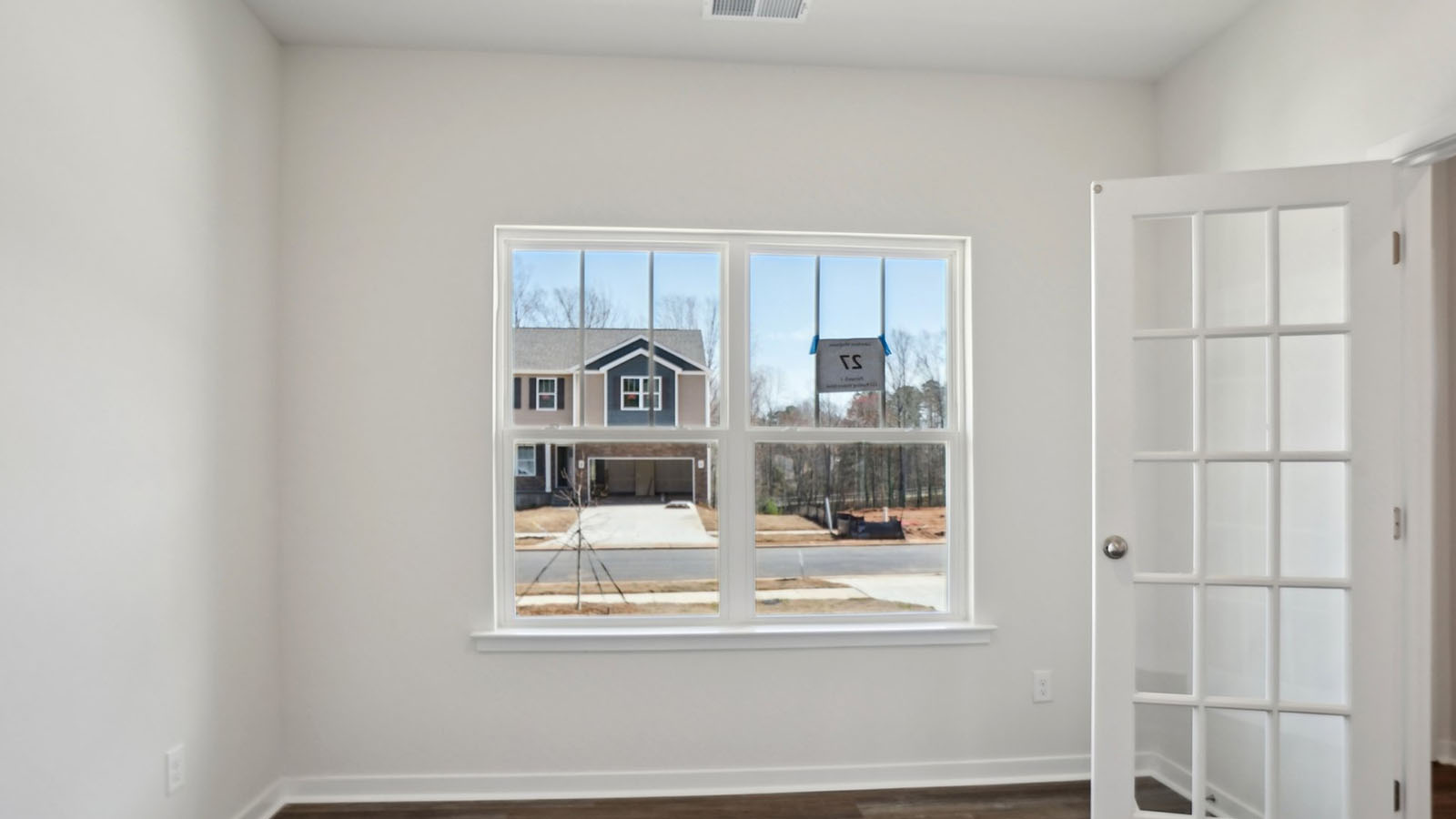 Dining room with wood floors, and sliding glass back door
