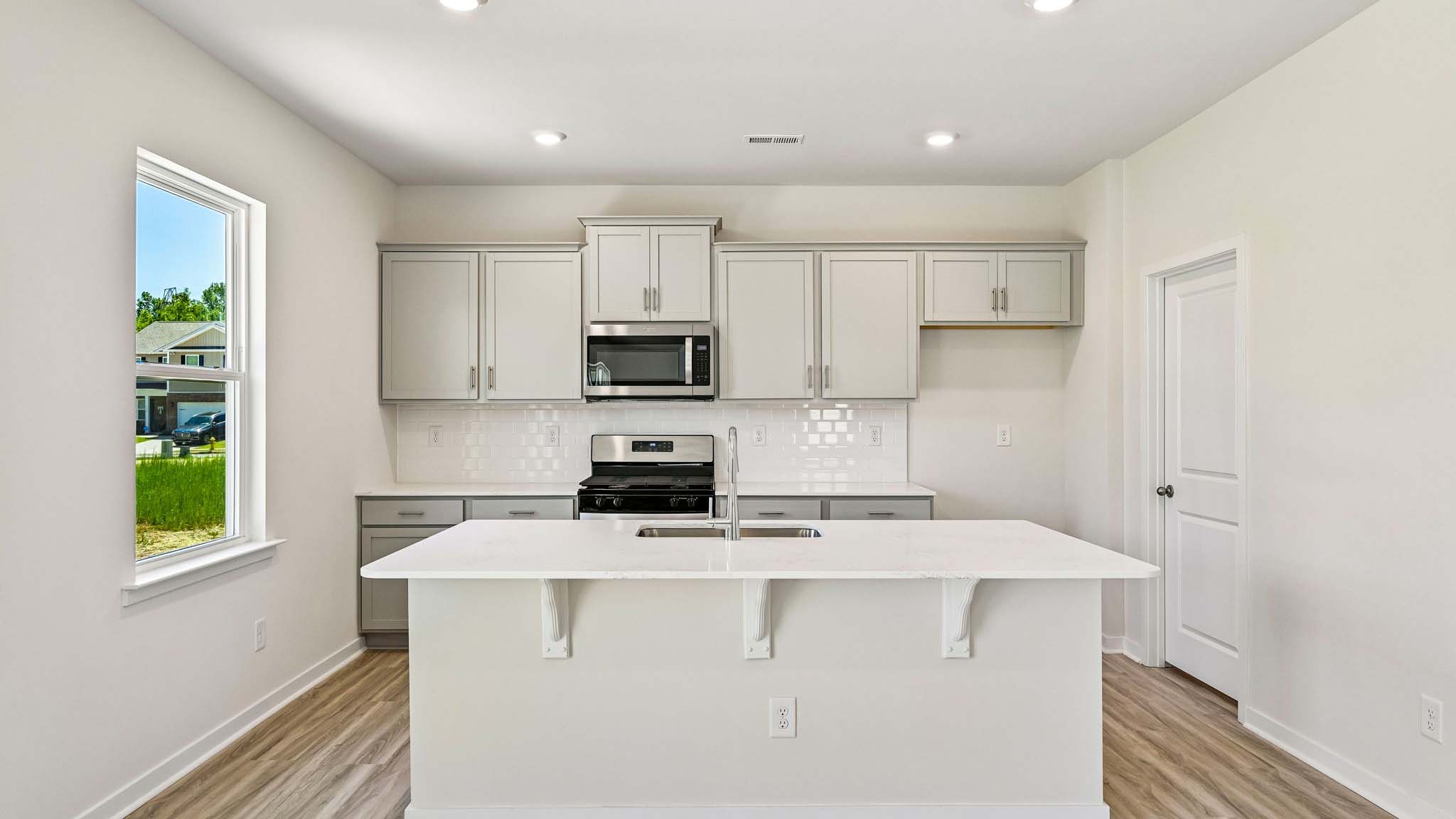 kitchen and island with stainless steel appliances