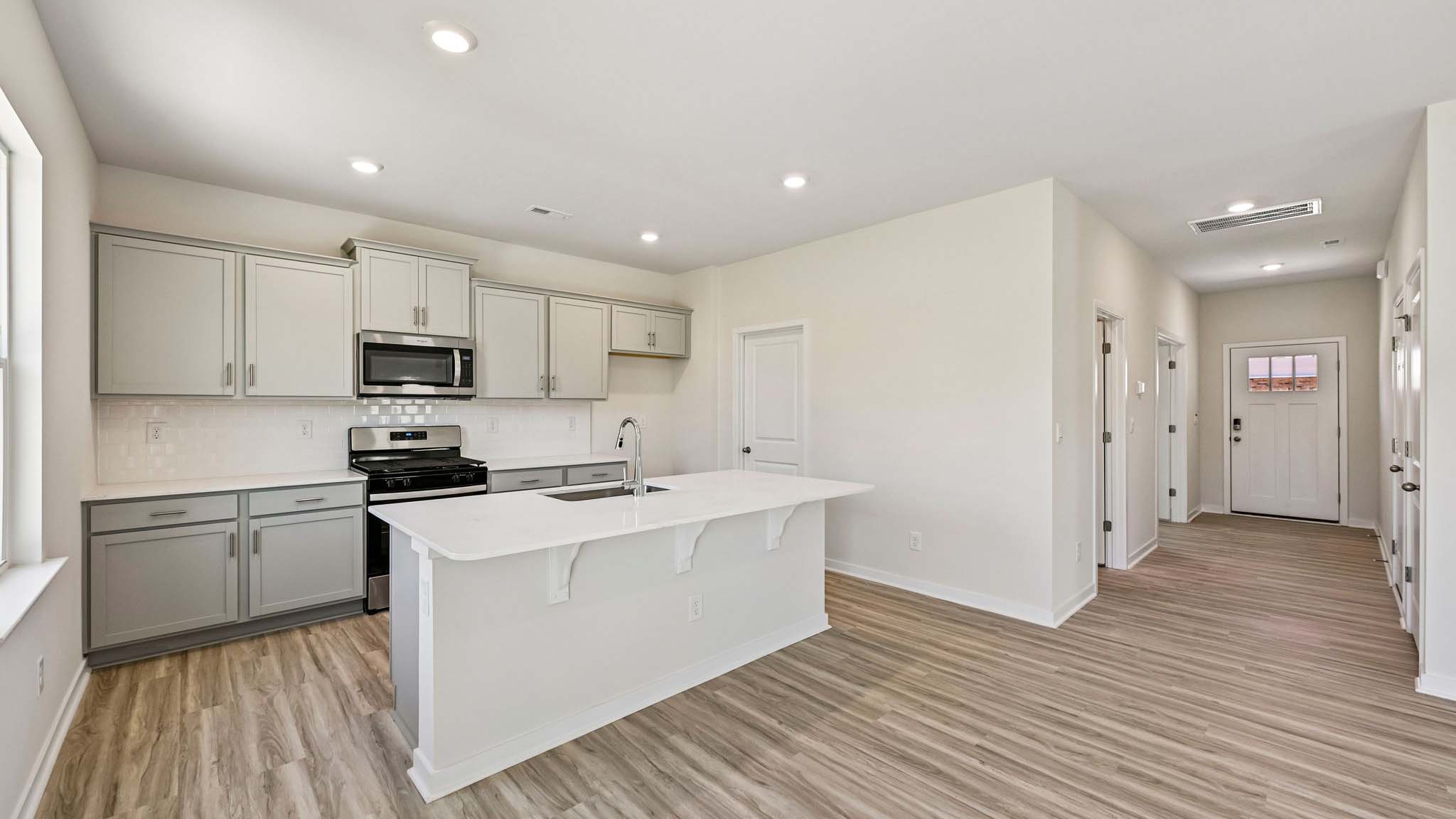 kitchen and island with stainless steel appliances