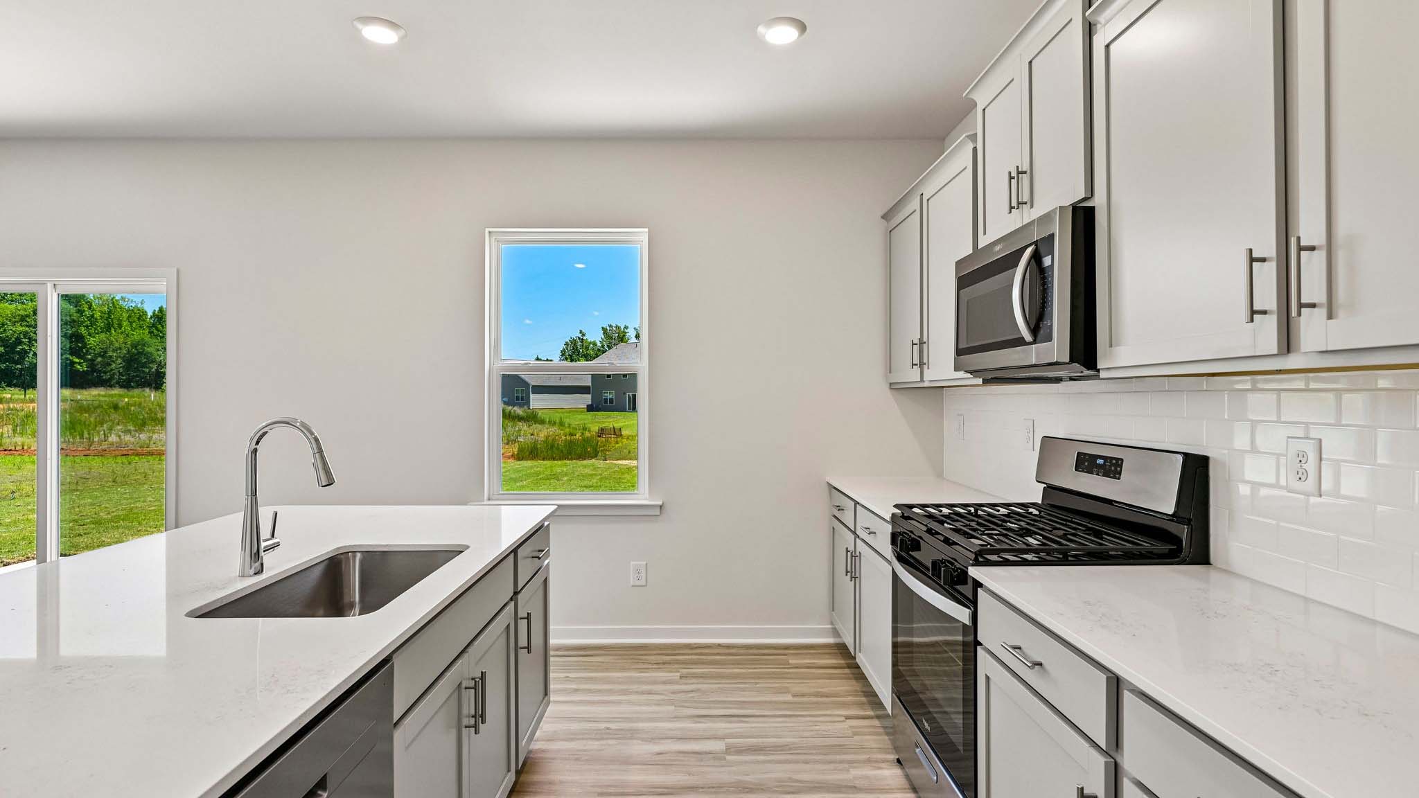 kitchen and island with stainless steel appliances