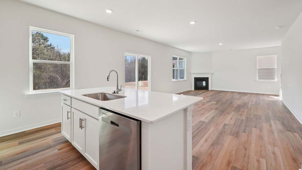 Kitchen and island with stainless steel appliances