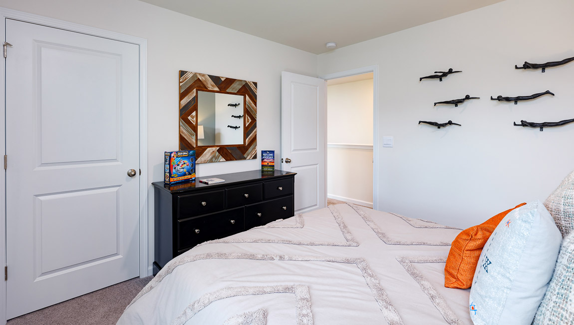 Carpeted bedroom with windows