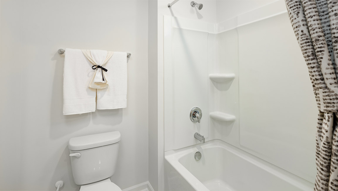 Bathroom with double sinks and tub shower