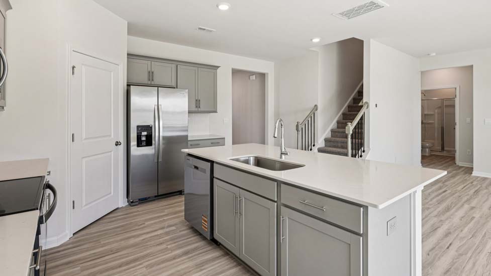 Kitchen and island with stainless steel appliances