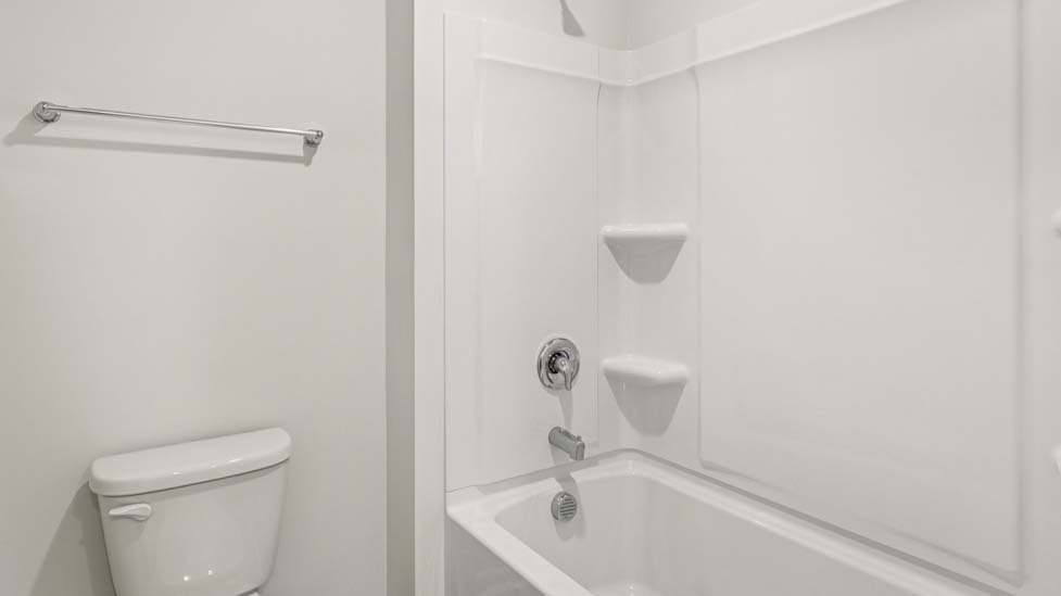 Bathroom with double sinks and tub shower