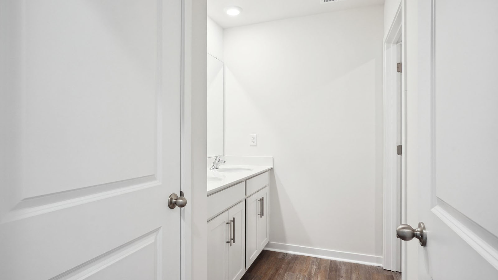 Bathroom with double sinks and tub shower