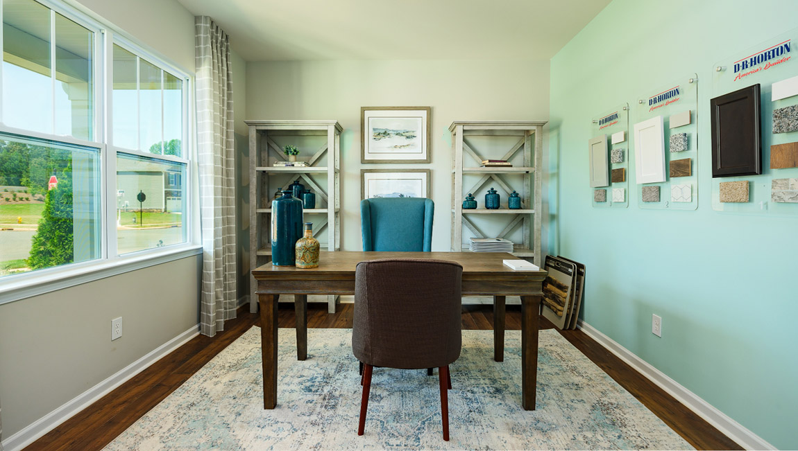 Model laundry room with rack above machines