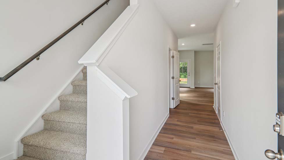Welcoming foyer with view of stairs
