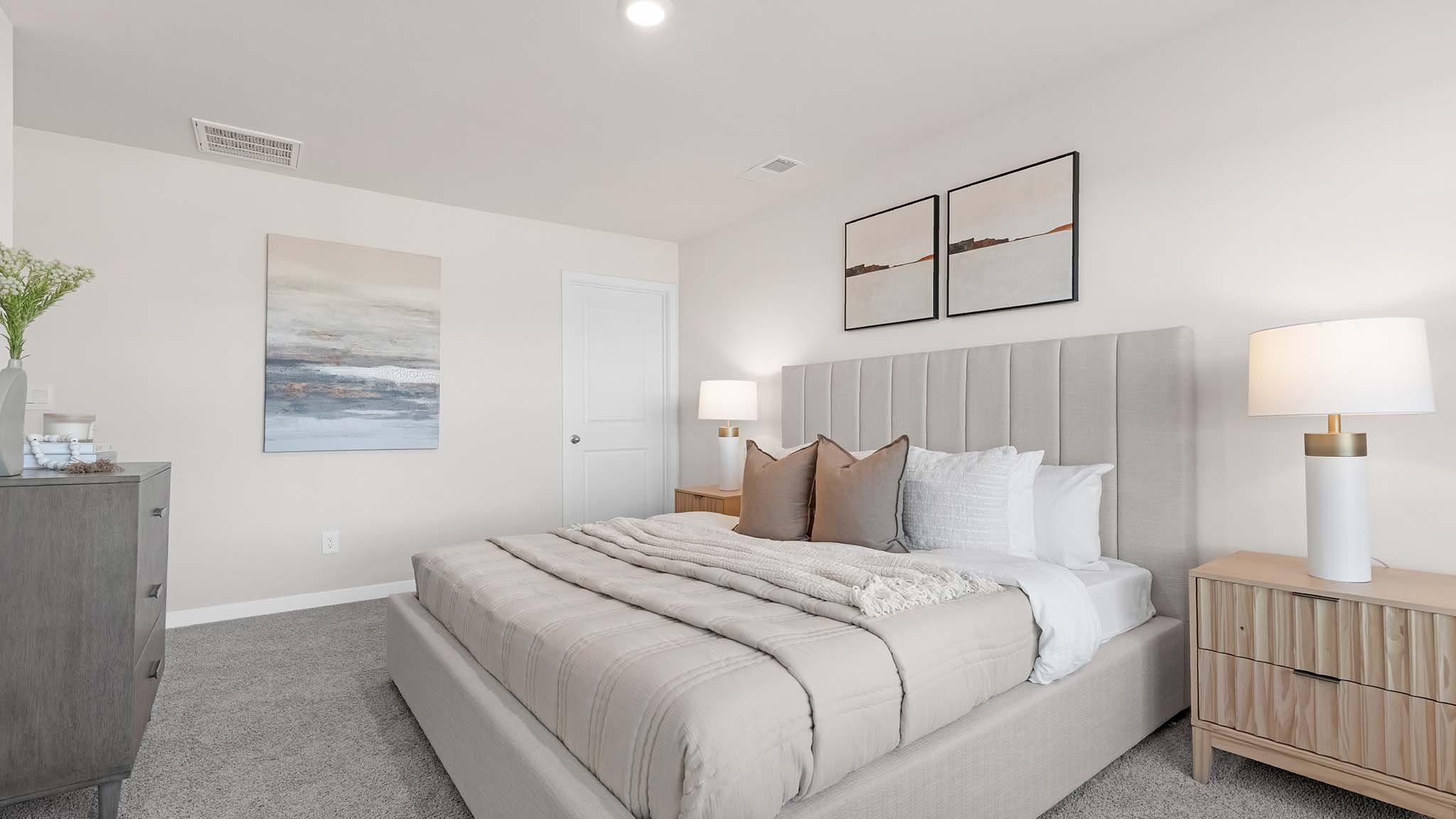 primary bedroom with carpet and large window
