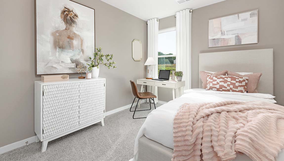 Carpeted bedroom with small window