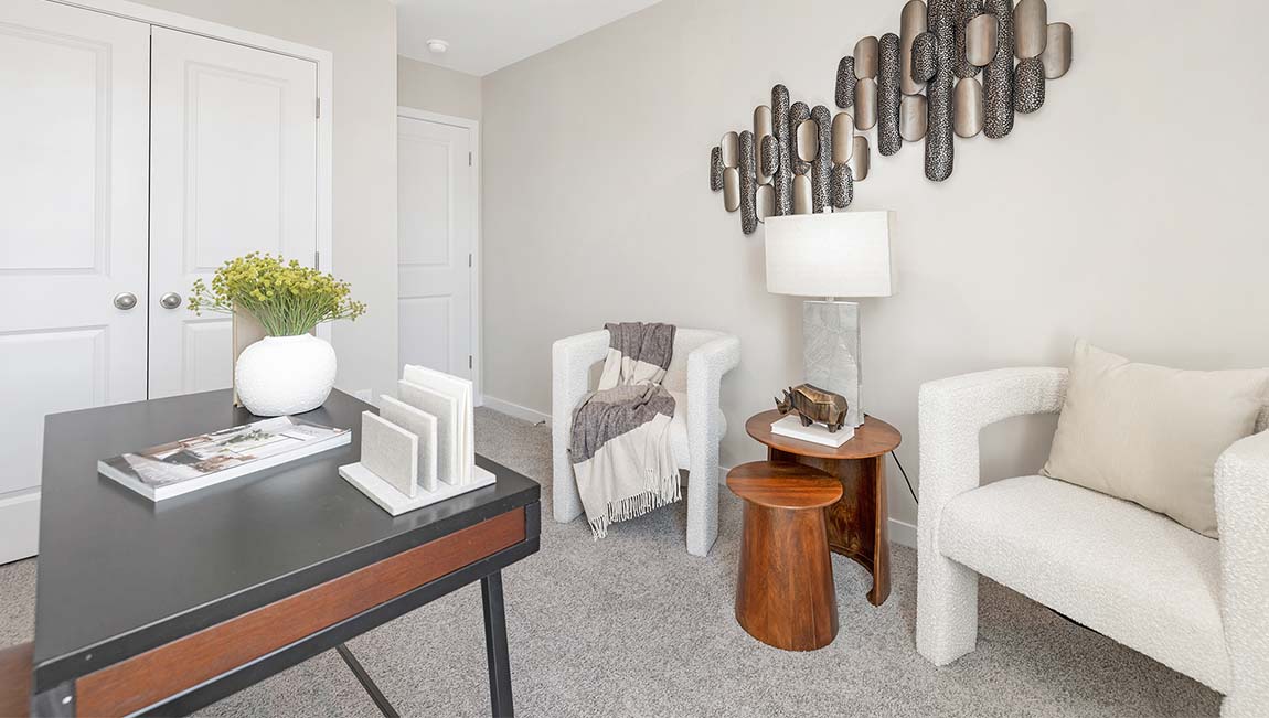 Carpeted bedroom with small window