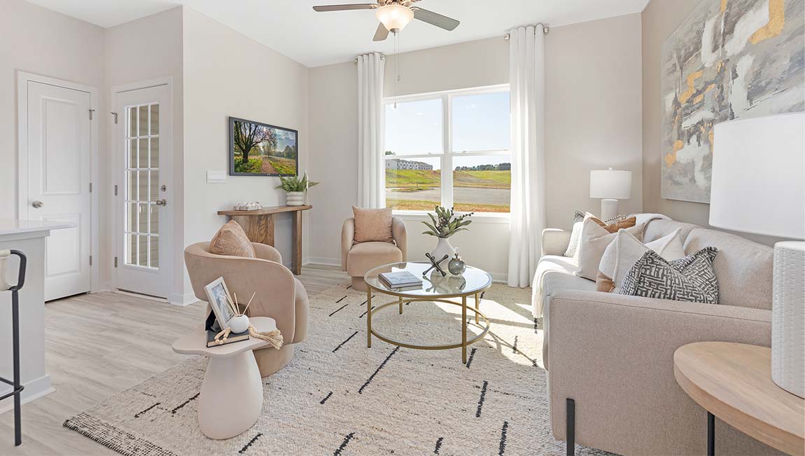 Family room with large window, beside kitchen