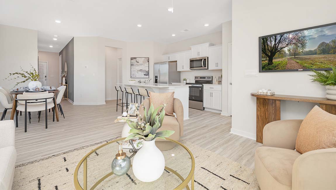 Family room with large window, beside kitchen