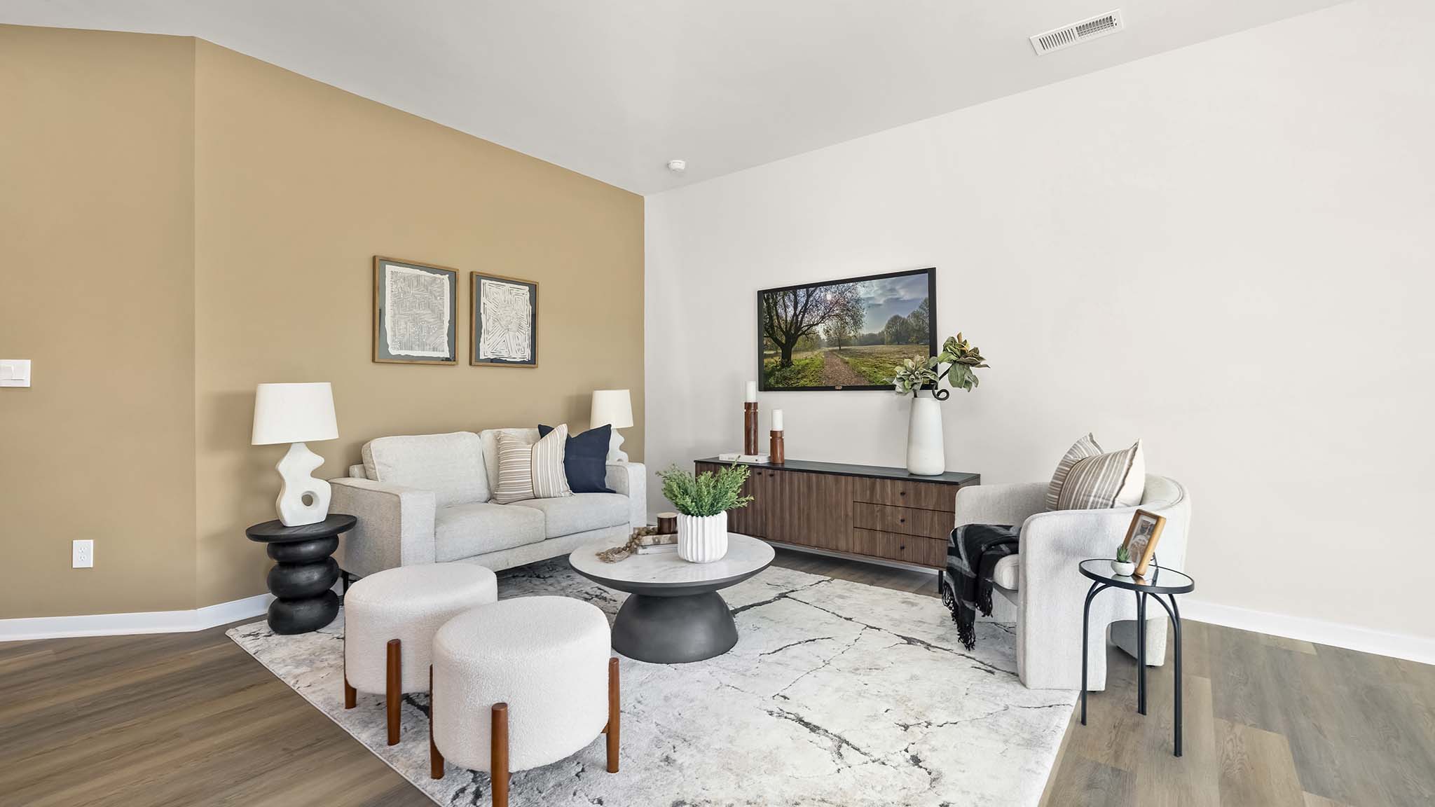 modern open family room with wood floor and large window