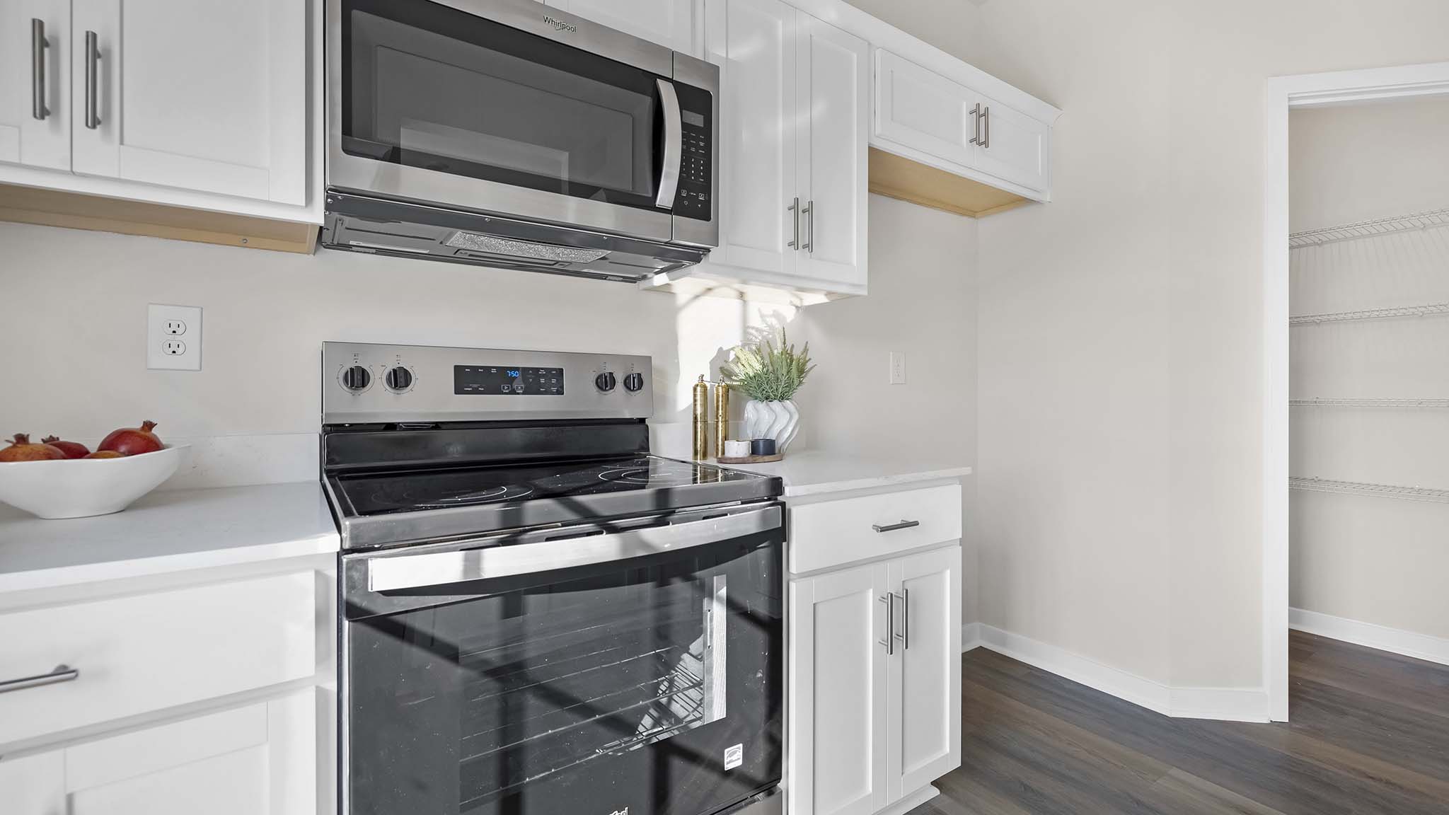 kitchen with white cabinets, and stainless steel appliances