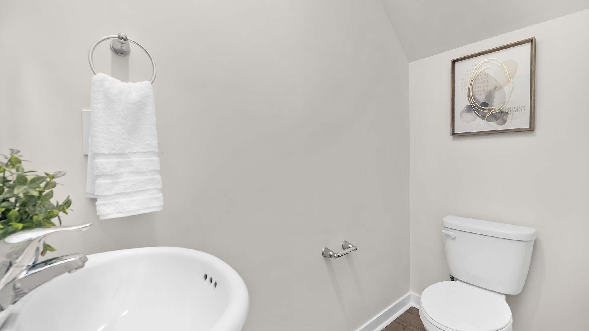 primary bathroom with double sinks, grey cabinets, and white counter