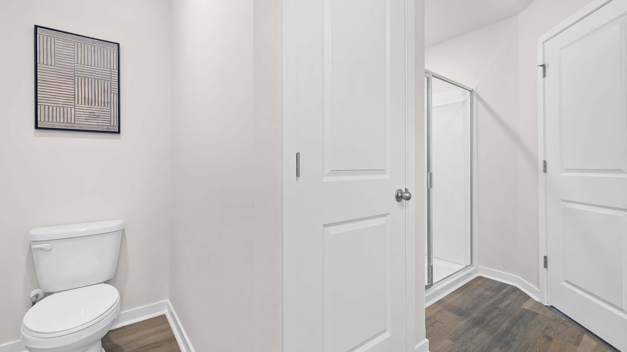 carpeted bedroom with small window