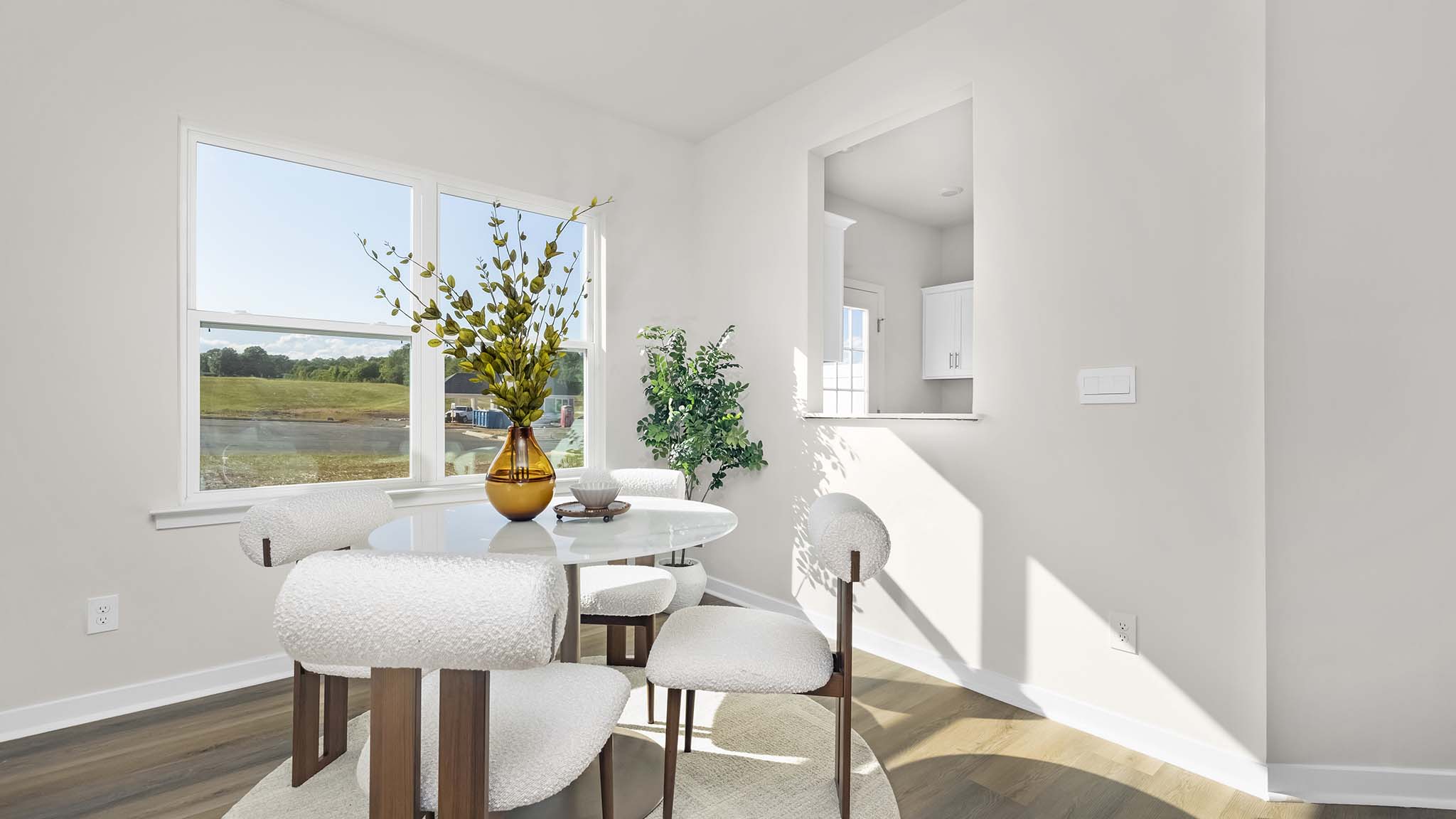 dining room with wood floors and large window