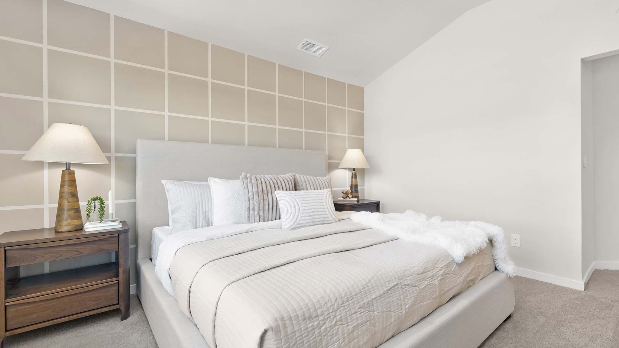 primary bedroom with carpet, and large window