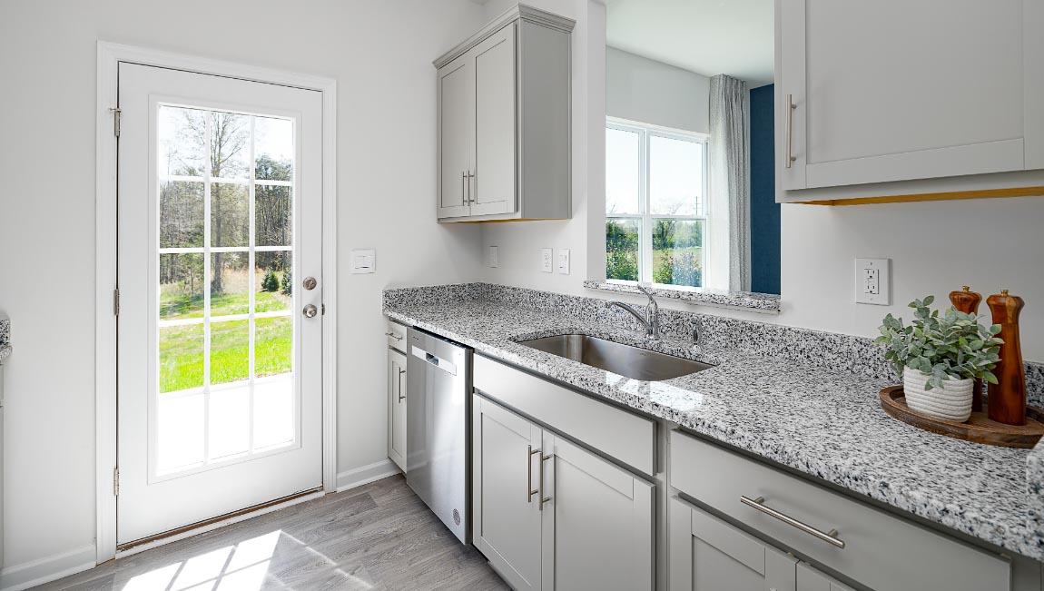 kitchen with white cabinets, and stainless steel appliances