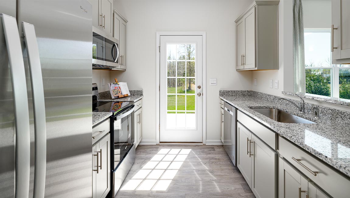 kitchen with white cabinets, and stainless steel appliances