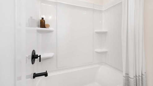 Bathroom with vanity and bathtub shower combination