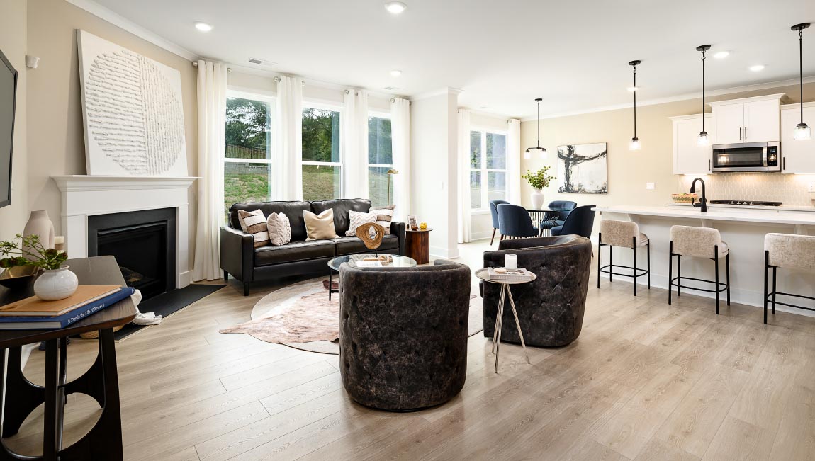 Open concept Living room area with large windows and fireplace