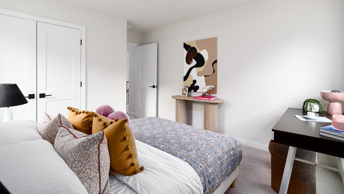Carpeted bedroom with windows