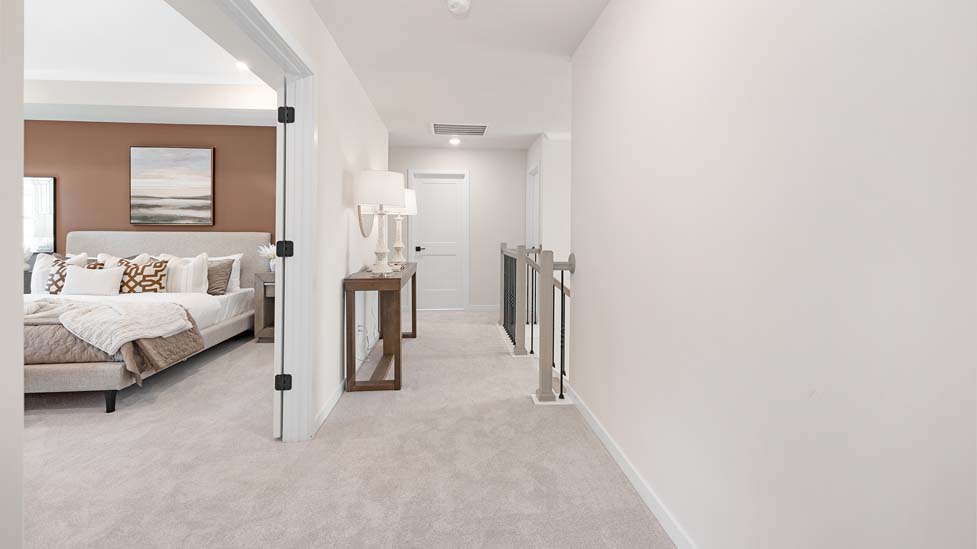 Carpeted bedroom with large windows