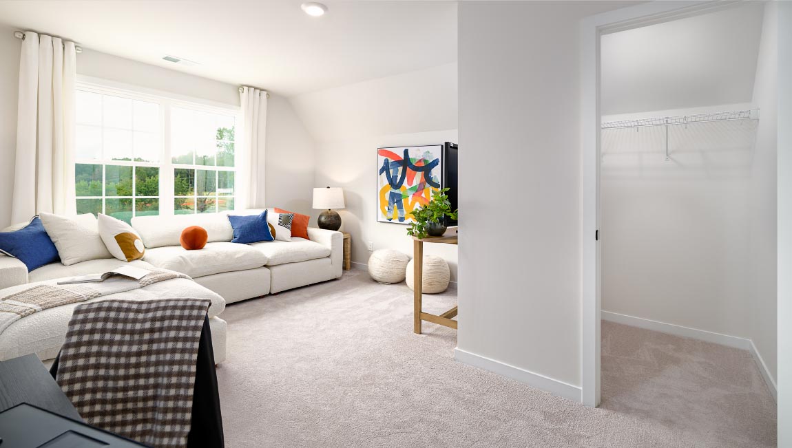 Carpeted bedroom with large windows