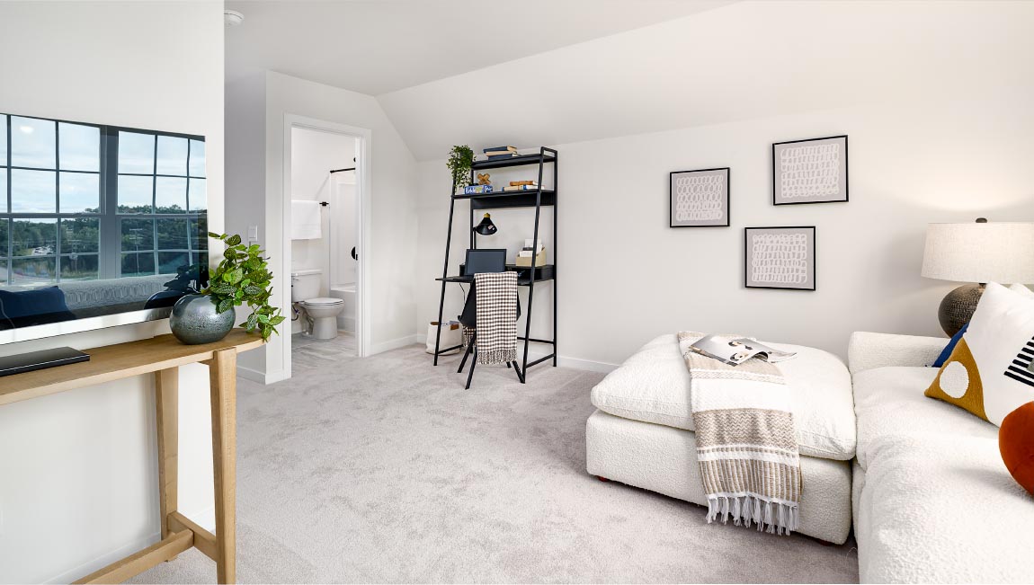 Carpeted bedroom with large windows