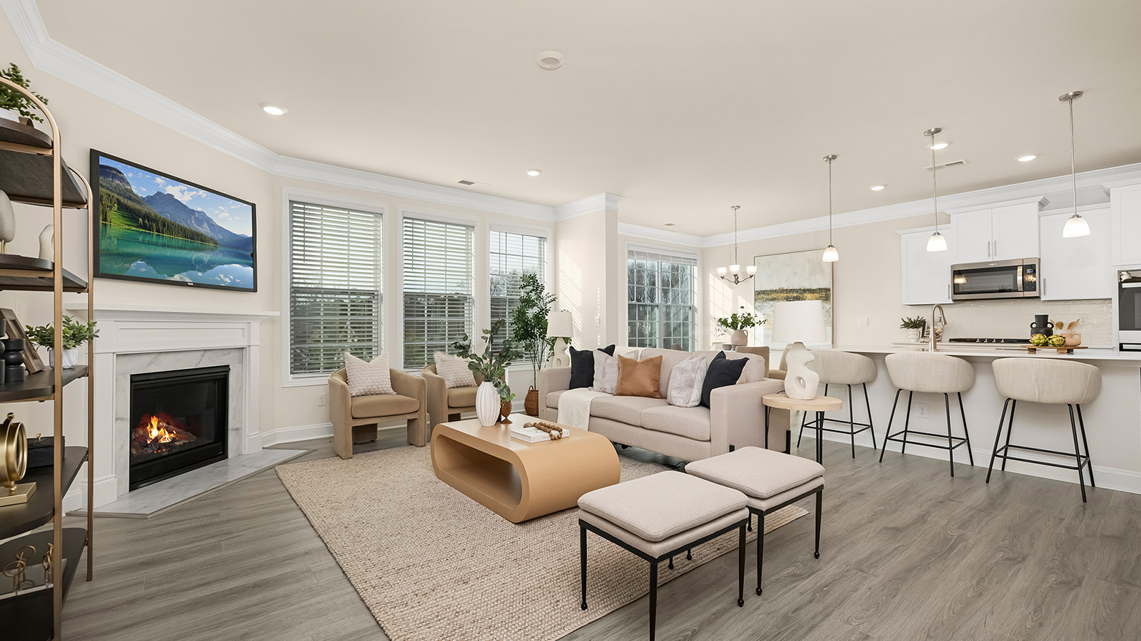 living room beside kitchen with fireplace
