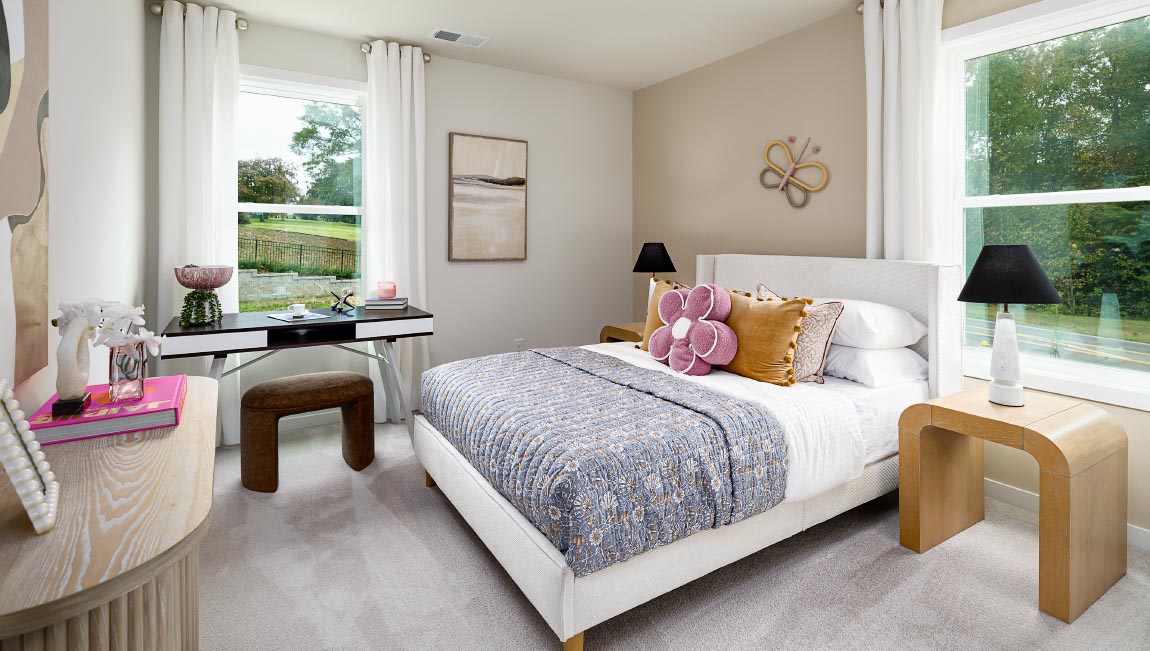 Carpeted bedroom with large windows