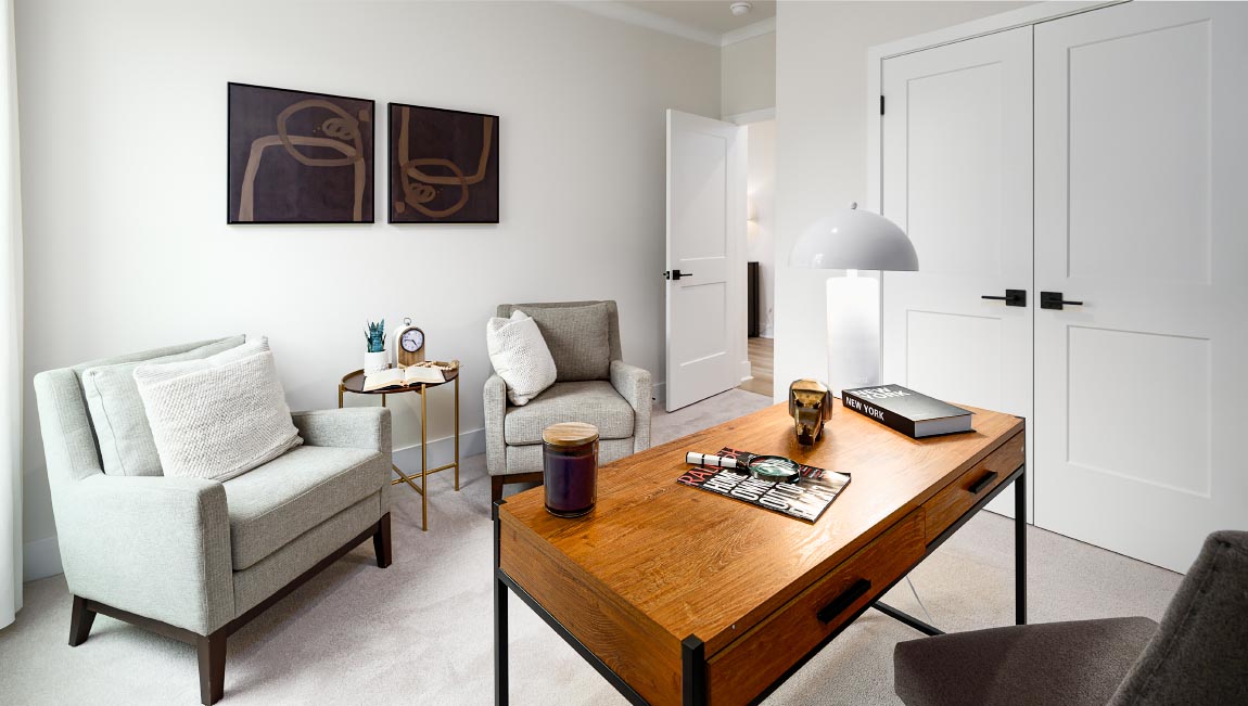 Carpeted bedroom with large windows
