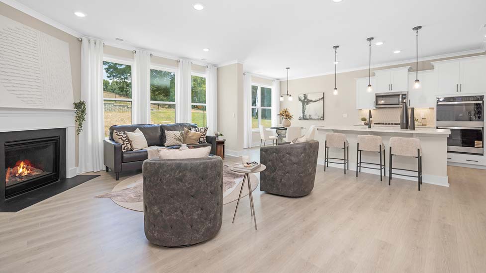 Open concept Living room area with large windows and fireplace