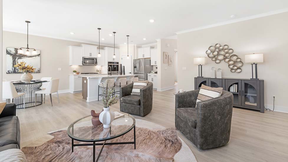 Open concept Living room area with large windows and fireplace
