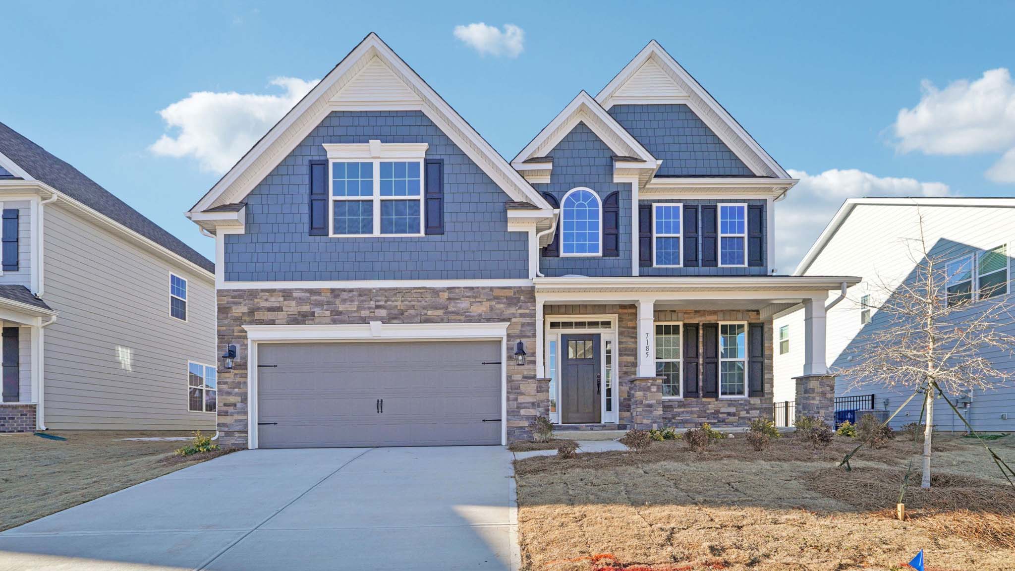 Fleetwood front exterior with double garage doors