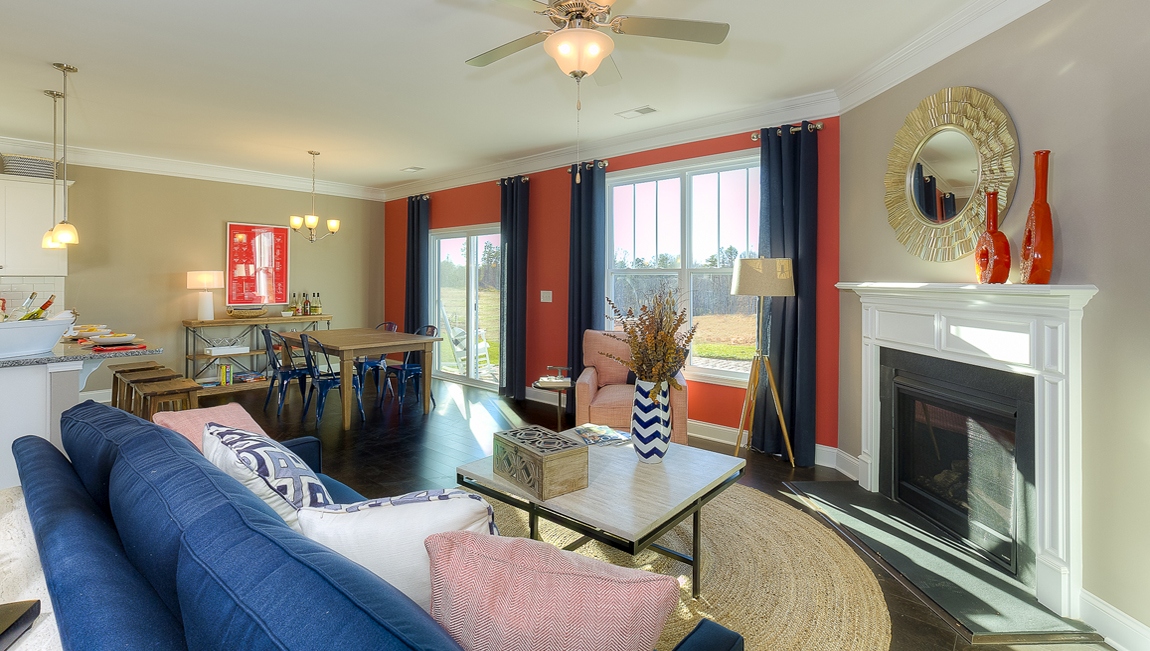 Family room with large window and fireplace