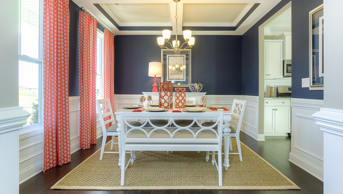 Dining room area with large windows and wood floors