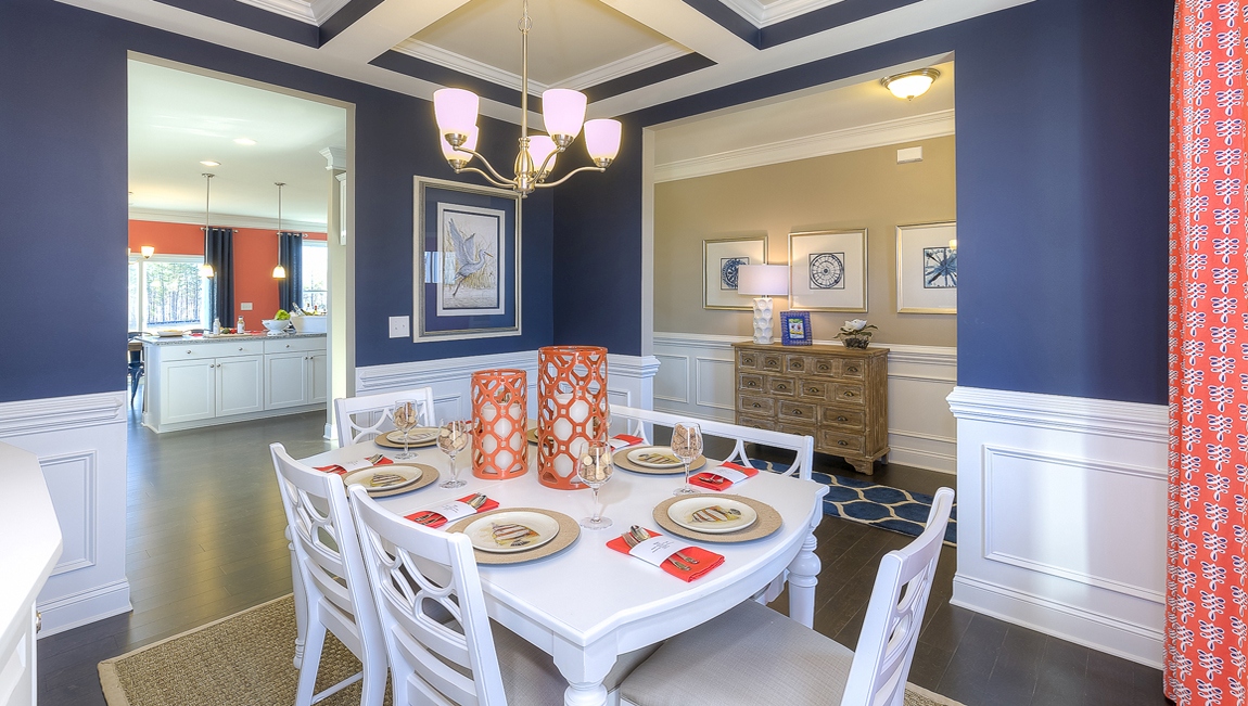 Dining room area with large windows and wood floors
