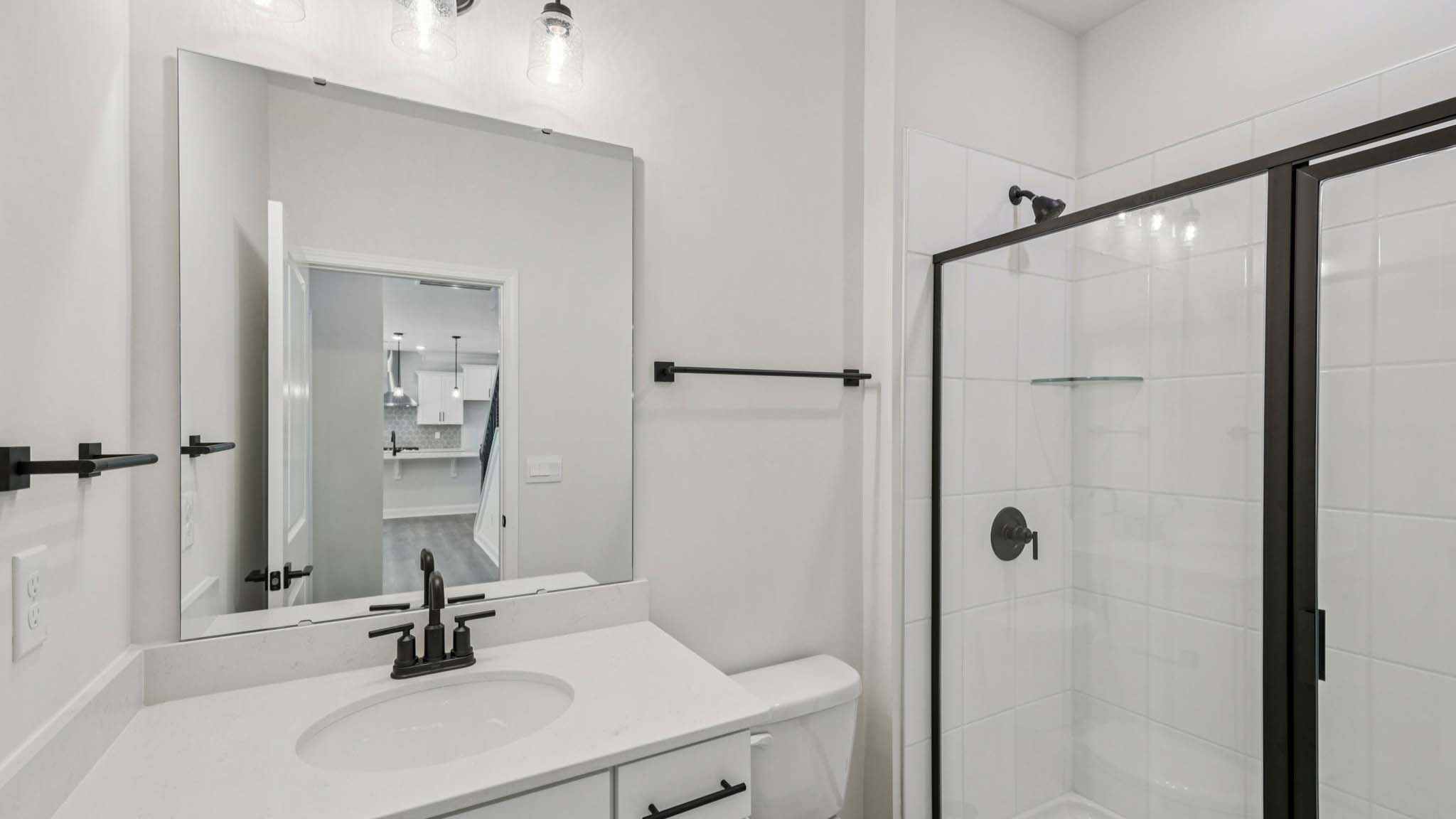 Bathroom with standing glass shower