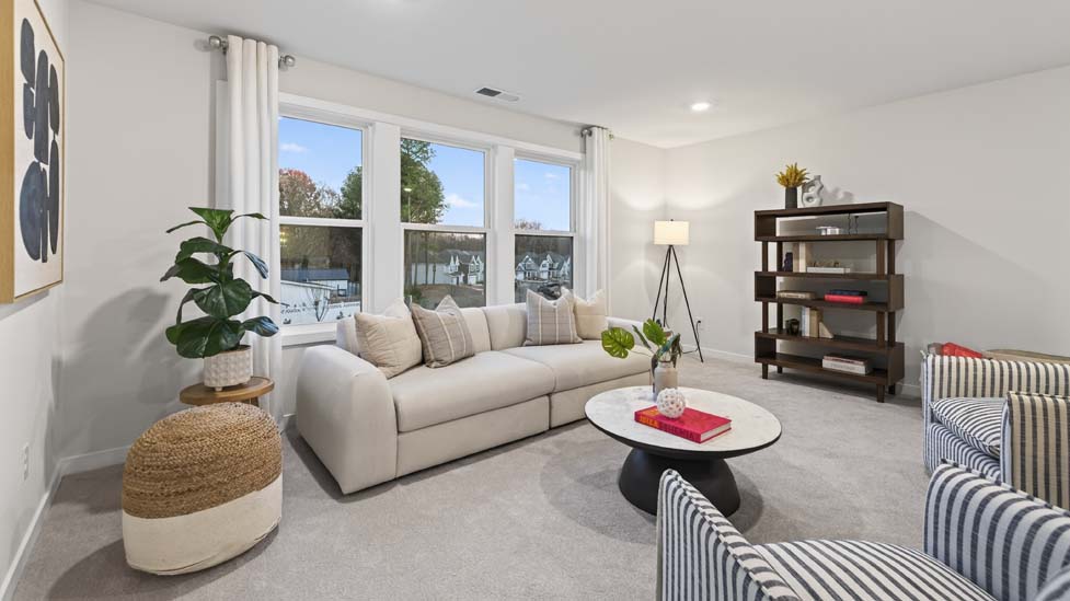 Upstairs open living area with carpet