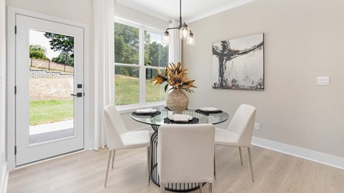 Breakfast area beside kitchen with sliding glass back door