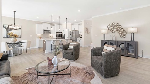 Open concept Living room area with large windows and fireplace