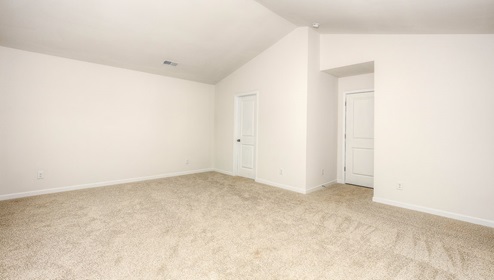 carpeted primary suite