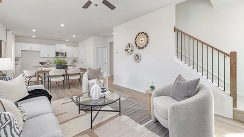 living room with large windows and electric fireplace. new homes in charlotte, nc